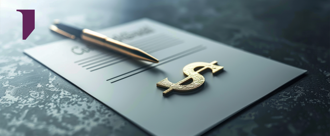 Pen resting on a signed sales contract beside a gold dollar sign, representing legal and financial terms of a sale